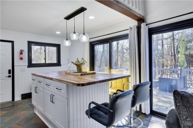 This 3 bed two bath fully remodeled home sits in an Amenity on Pocono Farms Country Club in Pennsylvania - for sale on GolfHomes.com, golf home, golf lot