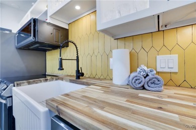 This 3 bed two bath fully remodeled home sits in an Amenity on Pocono Farms Country Club in Pennsylvania - for sale on GolfHomes.com, golf home, golf lot