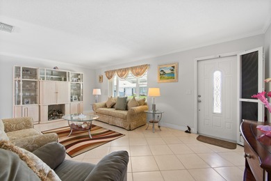 Nestled within 55+ Palm Beach Leisureville, this updated on Leisureville Community Golf Course in Florida - for sale on GolfHomes.com, golf home, golf lot