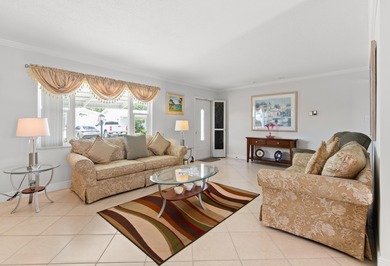 Nestled within 55+ Palm Beach Leisureville, this updated on Leisureville Community Golf Course in Florida - for sale on GolfHomes.com, golf home, golf lot