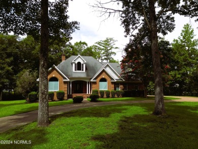 Waterfront home located on the water in a gated community called on Sound Golf Links at Albemarle Plantation in North Carolina - for sale on GolfHomes.com, golf home, golf lot