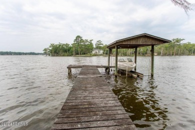 Waterfront home located on the water in a gated community called on Sound Golf Links at Albemarle Plantation in North Carolina - for sale on GolfHomes.com, golf home, golf lot