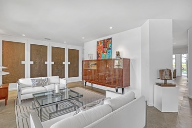 This stunning 5 Bedroom plus Den home overlooking the North Palm on North Palm Beach Country Club in Florida - for sale on GolfHomes.com, golf home, golf lot