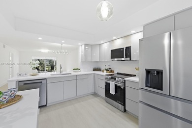 Experience luxury living in this stunning golf-view residence on Flamingo Lakes Country Club in Florida - for sale on GolfHomes.com, golf home, golf lot