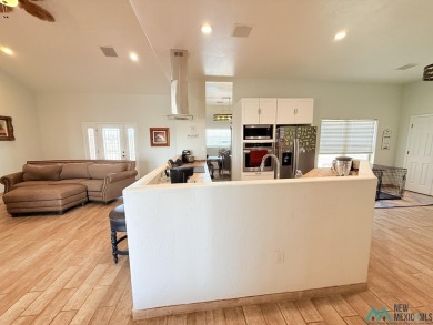 PANORAMIC VIEWS TO ENJOY FROM INDOORS OR THE COVERED PATIO on Sierra Del Rio Golf Club in New Mexico - for sale on GolfHomes.com, golf home, golf lot