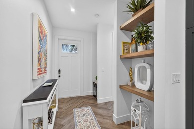 You'll find easy living in this move-in ready Arts and Crafts on Lake Worth Municipal Golf Course in Florida - for sale on GolfHomes.com, golf home, golf lot