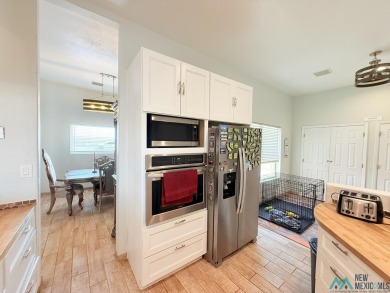 PANORAMIC VIEWS TO ENJOY FROM INDOORS OR THE COVERED PATIO on Sierra Del Rio Golf Club in New Mexico - for sale on GolfHomes.com, golf home, golf lot