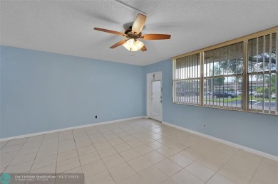 55+ COMMUNITY, THIS TURN KEY READY UNIT IS ON THE 1st FLOOR on Sunrise Lakes Phase III in Florida - for sale on GolfHomes.com, golf home, golf lot