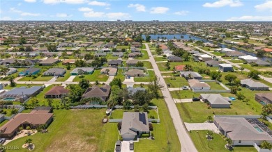 Lovely home in Southwest Cape Coral. Oversized, corner lot with on Royal Tee Country Club in Florida - for sale on GolfHomes.com, golf home, golf lot