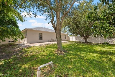 Lovely home in Southwest Cape Coral. Oversized, corner lot with on Royal Tee Country Club in Florida - for sale on GolfHomes.com, golf home, golf lot