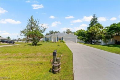 Lovely home in Southwest Cape Coral. Oversized, corner lot with on Royal Tee Country Club in Florida - for sale on GolfHomes.com, golf home, golf lot