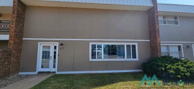 Welcome to this charming 2 bedroom, 2.5 bath brick condo on Chaparral Country Club in New Mexico - for sale on GolfHomes.com, golf home, golf lot