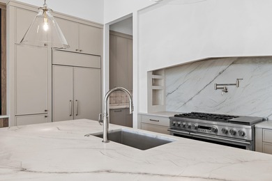 Less than a mile from the beach, this breathtaking new on Regatta Bay Golf and Country Club in Florida - for sale on GolfHomes.com, golf home, golf lot