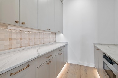 Less than a mile from the beach, this breathtaking new on Regatta Bay Golf and Country Club in Florida - for sale on GolfHomes.com, golf home, golf lot