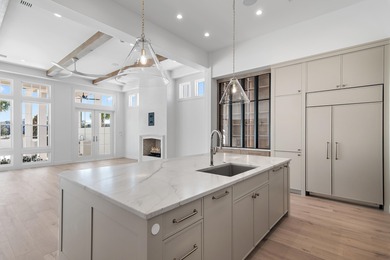 Less than a mile from the beach, this breathtaking new on Regatta Bay Golf and Country Club in Florida - for sale on GolfHomes.com, golf home, golf lot