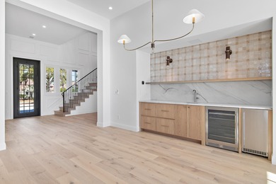 Less than a mile from the beach, this breathtaking new on Regatta Bay Golf and Country Club in Florida - for sale on GolfHomes.com, golf home, golf lot