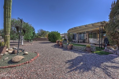 This Sun City home is delightful! Its spacious layout and large on PalmBrook Country Club in Arizona - for sale on GolfHomes.com, golf home, golf lot