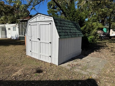 Oversized lot with park trailer, septic, room addition, deck on Captains Cove Golf and Yacht Club in Virginia - for sale on GolfHomes.com, golf home, golf lot