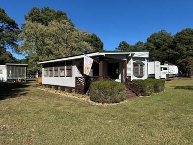 Oversized lot with park trailer, septic, room addition, deck on Captains Cove Golf and Yacht Club in Virginia - for sale on GolfHomes.com, golf home, golf lot