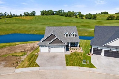 This 2024 Parade of Homes by Hodge Construction overlooks the on Saddleback Ridge Golf Course in Iowa - for sale on GolfHomes.com, golf home, golf lot