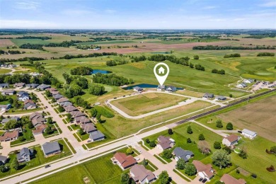 This 2024 Parade of Homes by Hodge Construction overlooks the on Saddleback Ridge Golf Course in Iowa - for sale on GolfHomes.com, golf home, golf lot