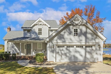Waterfront home with stunning views located in the gated and on Carolina Trace Country Club in North Carolina - for sale on GolfHomes.com, golf home, golf lot
