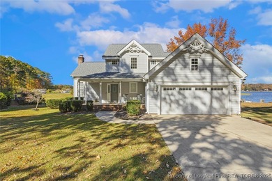 Waterfront home with stunning views located in the gated and on Carolina Trace Country Club in North Carolina - for sale on GolfHomes.com, golf home, golf lot