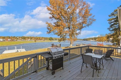 Waterfront home with stunning views located in the gated and on Carolina Trace Country Club in North Carolina - for sale on GolfHomes.com, golf home, golf lot