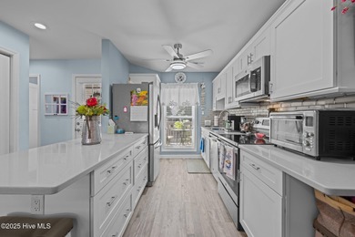 Enjoy effortless waterfront living in this beautifully updated on Harbour Point Golf Club in North Carolina - for sale on GolfHomes.com, golf home, golf lot