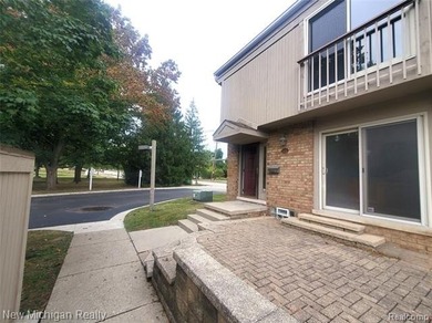 Beautifully updated end-unit brick condo in the highly desirable on Great Oaks Country Club in Michigan - for sale on GolfHomes.com, golf home, golf lot
