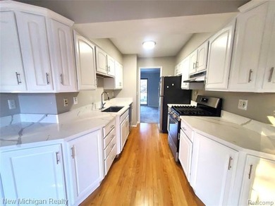 Beautifully updated end-unit brick condo in the highly desirable on Great Oaks Country Club in Michigan - for sale on GolfHomes.com, golf home, golf lot