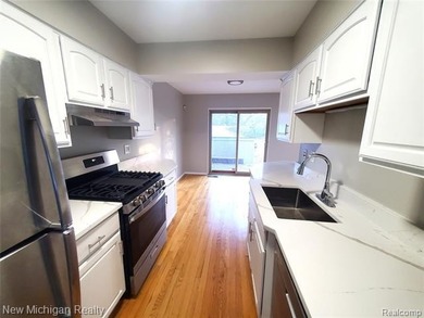 Beautifully updated end-unit brick condo in the highly desirable on Great Oaks Country Club in Michigan - for sale on GolfHomes.com, golf home, golf lot