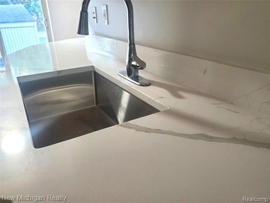 Beautifully updated end-unit brick condo in the highly desirable on Great Oaks Country Club in Michigan - for sale on GolfHomes.com, golf home, golf lot