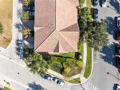 Welcome to this spacious end-unit townhome in the guard-gated on Eagle Creek Golf Club in Florida - for sale on GolfHomes.com, golf home, golf lot