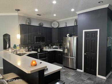 Nestled in the sought-after Southern Links community of Fleming on Golf Club At Fleming Island in Florida - for sale on GolfHomes.com, golf home, golf lot