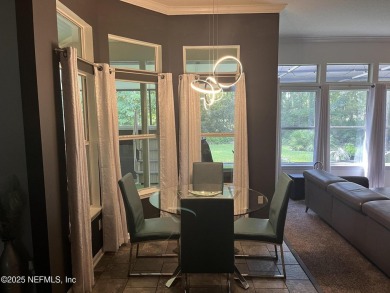 Nestled in the sought-after Southern Links community of Fleming on Golf Club At Fleming Island in Florida - for sale on GolfHomes.com, golf home, golf lot
