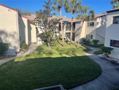 Spacious 3 bedroom, 2 bath split plan condo in a desirable on East Bay Golf Club in Florida - for sale on GolfHomes.com, golf home, golf lot