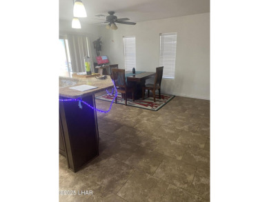 This home has been updated with a new heat pump AC conditioner on London Bridge Golf Course in Arizona - for sale on GolfHomes.com, golf home, golf lot