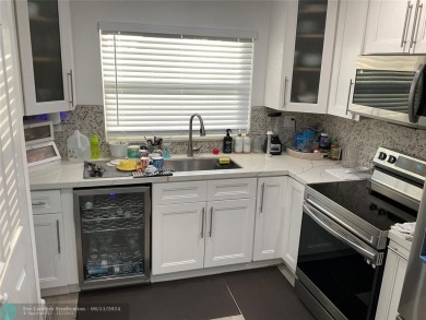 WELL KEPT CONDO WITH UPGRADED KITCHEN WITH QUARTZ COUNTERTOPS on Sunrise Lakes Phase III in Florida - for sale on GolfHomes.com, golf home, golf lot