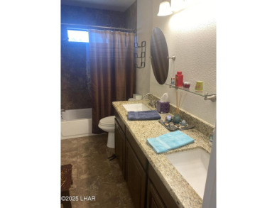 This home has been updated with a new heat pump AC conditioner on London Bridge Golf Course in Arizona - for sale on GolfHomes.com, golf home, golf lot
