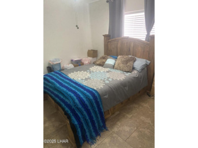 This home has been updated with a new heat pump AC conditioner on London Bridge Golf Course in Arizona - for sale on GolfHomes.com, golf home, golf lot
