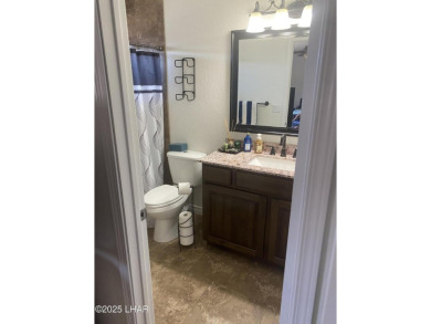 This home has been updated with a new heat pump AC conditioner on London Bridge Golf Course in Arizona - for sale on GolfHomes.com, golf home, golf lot