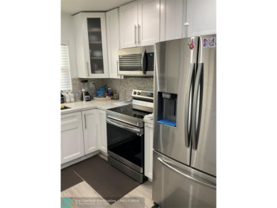 WELL KEPT CONDO WITH UPGRADED KITCHEN WITH QUARTZ COUNTERTOPS on Sunrise Lakes Phase III in Florida - for sale on GolfHomes.com, golf home, golf lot