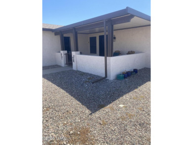This home has been updated with a new heat pump AC conditioner on London Bridge Golf Course in Arizona - for sale on GolfHomes.com, golf home, golf lot