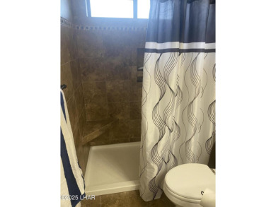 This home has been updated with a new heat pump AC conditioner on London Bridge Golf Course in Arizona - for sale on GolfHomes.com, golf home, golf lot