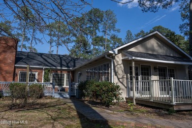 Discover a sanctuary of quiet elegance at 614 Lake Shore Drive on Walnut Creek Country Club in North Carolina - for sale on GolfHomes.com, golf home, golf lot