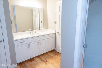 Discover a sanctuary of quiet elegance at 614 Lake Shore Drive on Walnut Creek Country Club in North Carolina - for sale on GolfHomes.com, golf home, golf lot