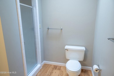 Discover a sanctuary of quiet elegance at 614 Lake Shore Drive on Walnut Creek Country Club in North Carolina - for sale on GolfHomes.com, golf home, golf lot