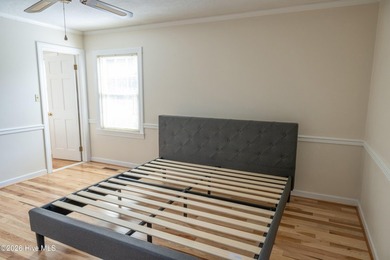 Discover a sanctuary of quiet elegance at 614 Lake Shore Drive on Walnut Creek Country Club in North Carolina - for sale on GolfHomes.com, golf home, golf lot