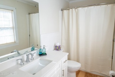 Discover a sanctuary of quiet elegance at 614 Lake Shore Drive on Walnut Creek Country Club in North Carolina - for sale on GolfHomes.com, golf home, golf lot